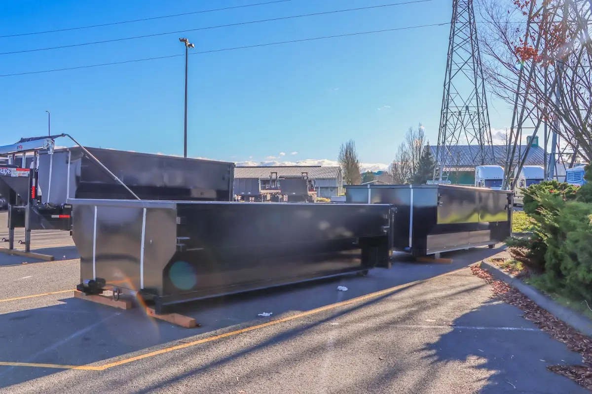 Roll-off dumpster ready for waste disposal at job site for 2 Yard Dumpster Rental in Dinuba